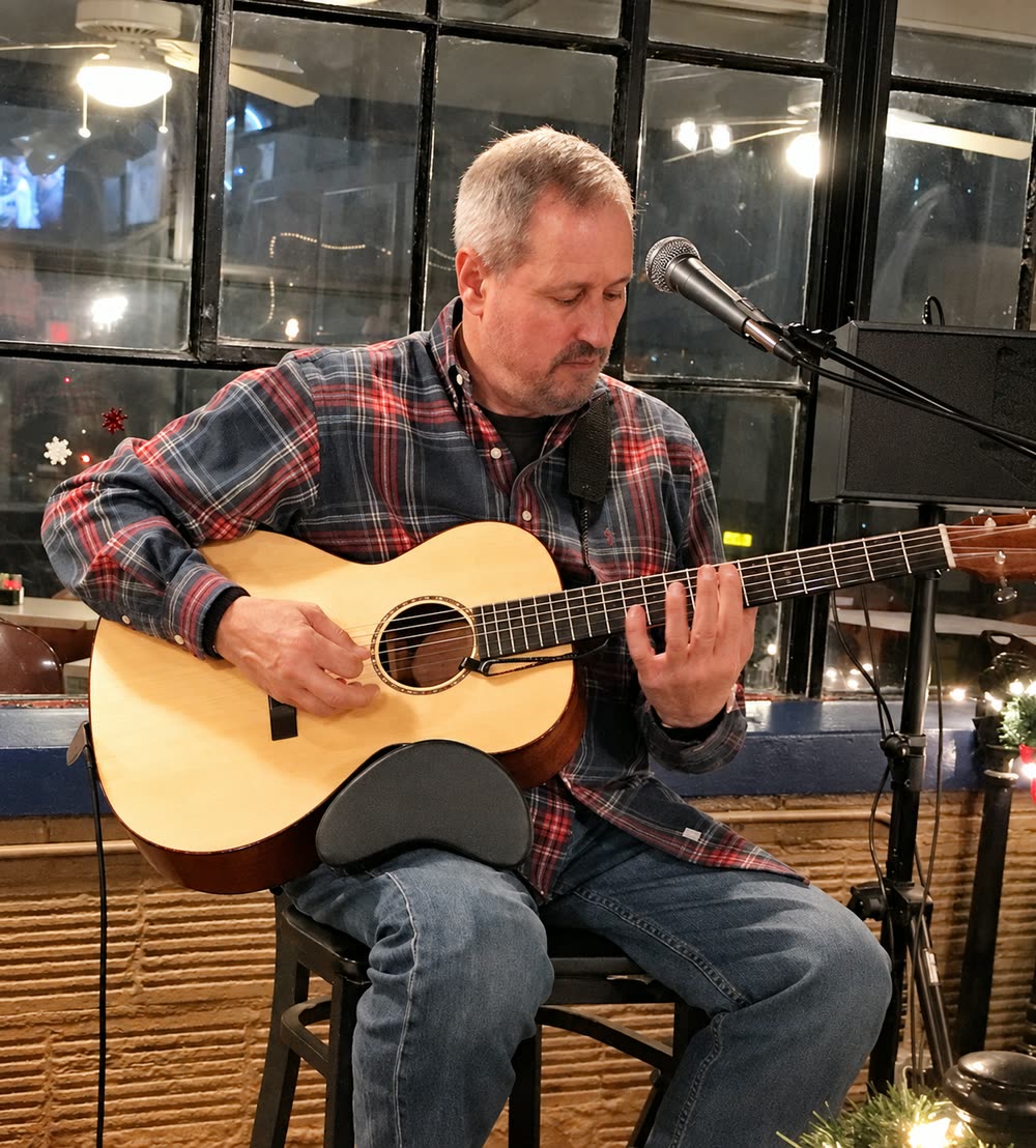 Joe Caporaso playing solo acoustic guitar
